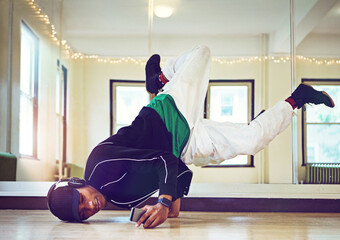 Headphones, music and hip hop dancer for practice, performance with talent, skill and movement for...