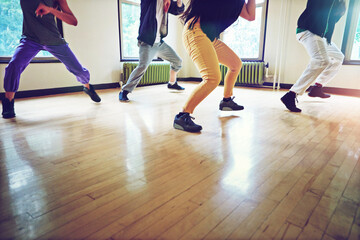 Fototapeta premium Dance, group and energy with motion, studio and freedom for creative art performance. People, culture and hip hop with breakdance, rehearsal and practice for community expression in dancing class