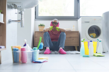 Frustrated woman cleaning up her home