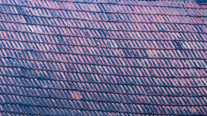 A blue and pink roof with a pattern of squares