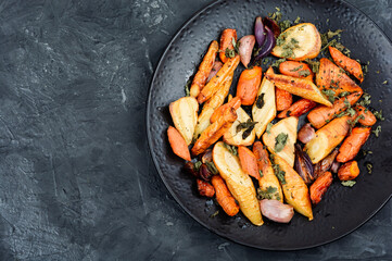 Roasted parsnip root and carrots.