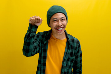 Knock-knock. Who's there? An excited young Asian man is gesturing a door knock, asking who is home. He appears embarrassed, clueless, and uncertain while standing against a white background