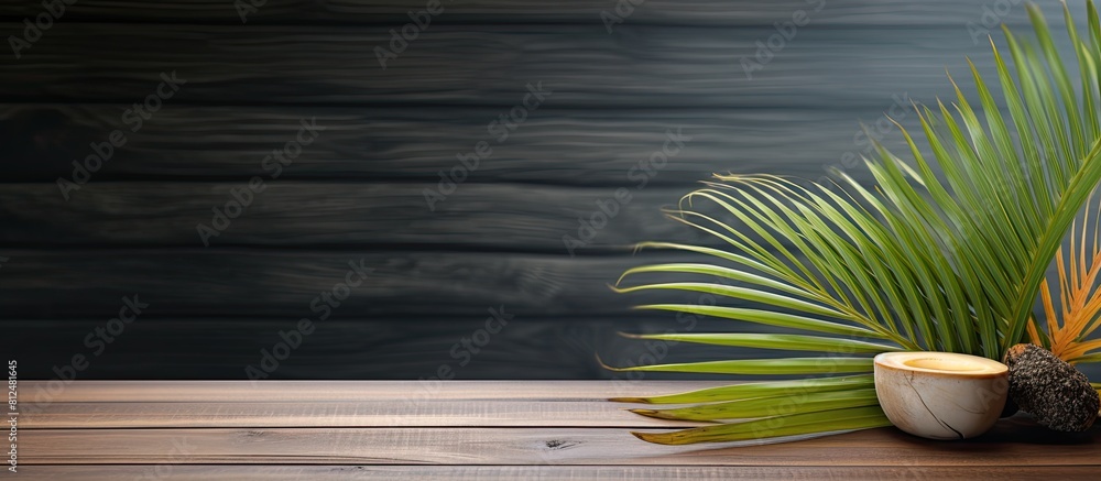 Poster aesthetic copy space image of a spa setting with a palm leaf placed delicately on a wooden table