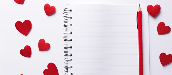 An isolated copy space image of a notebook adorned with red pen and heart designs on a white background