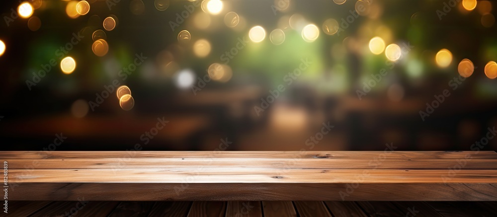 Poster coffee shop blur background with bokeh and an empty wooden table providing copy space for images