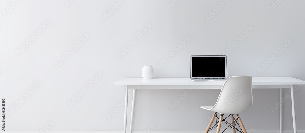 Poster A white table with a chair and a laptop creating a minimalist setting with copy space image