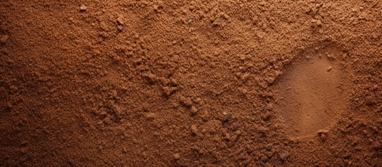 The coarse and gritty texture of sandpaper ideal for smoothing rough surfaces is captured in this close up copy space image