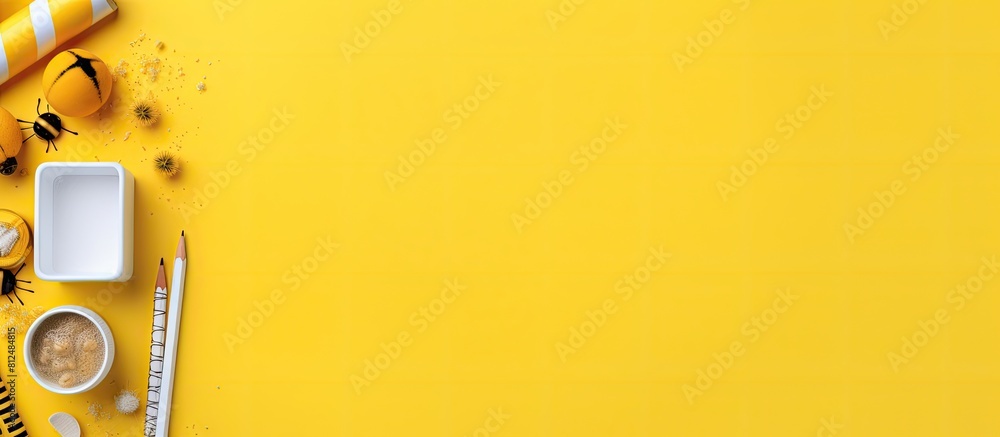 Aufkleber The back to school theme features white and yellow school tools and a rocket on a blue background The objects are arranged in a flat lay style with a top view and there is ample copy space available