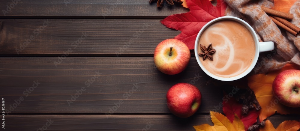 Aufkleber autumn flat lay of an organic cup of cocoa topped with cinnamon apples and nuts creating a warming a