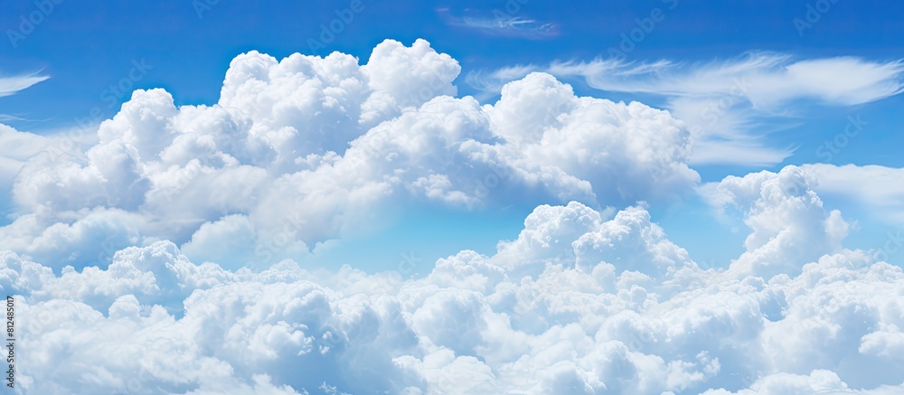 Aufkleber Background copy space image of a sky filled with fluffy white clouds against a vibrant blue backdrop