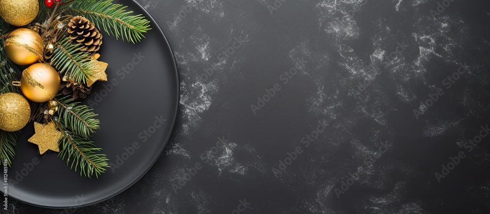 Poster top view of a christmas table setting on a black stone background the elegant arrangement includes a