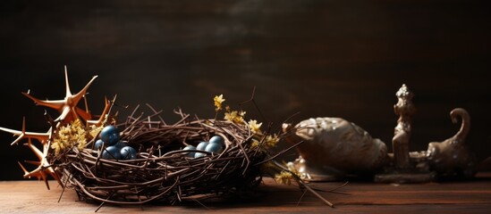 Close up copy space image of Easter attributes including a crown of thorns and a hammer resting on a wooden table