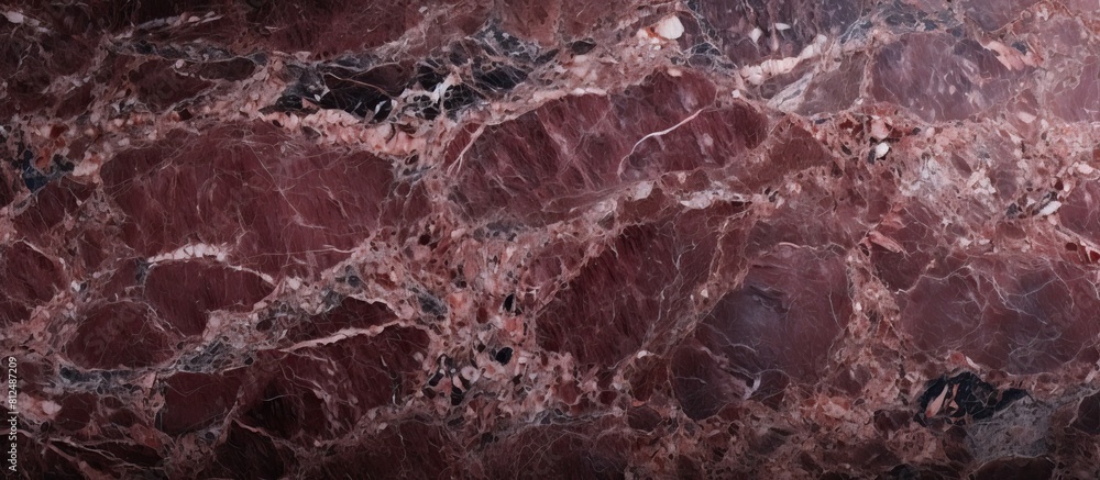 Poster Close up image of a polished dark red granite background with a textured natural appearance Ample space for inserting content