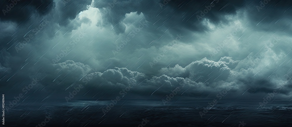 Aufkleber A dark sky with rain clouds and falling rain providing a copy space image with a textured backdrop of clouds