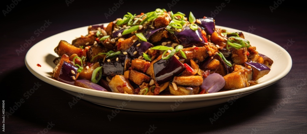 Poster a delicious chinese dish with eggplant and pork stir fried in oyster sauce presented in a copy space