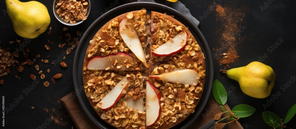 Poster A top down view of a delectable crumble made with oats cinnamon and pears adorned with hazelnuts and drizzled with honey It sits in a dark brown stone concrete frying pan offering ample copy space fo