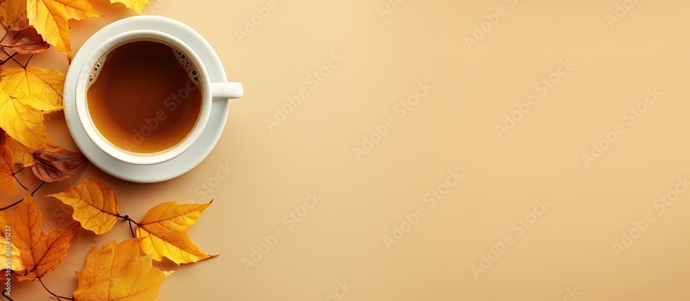 Poster in autumn enjoy a cup of coffee surrounded by golden yellow leaves and jot down some notes copy spac