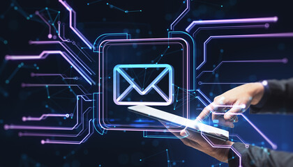 Close up of male hand using smartphone with creative square circuit button hologram with email icon on dark background. Technology and e-mail newsletter concept.