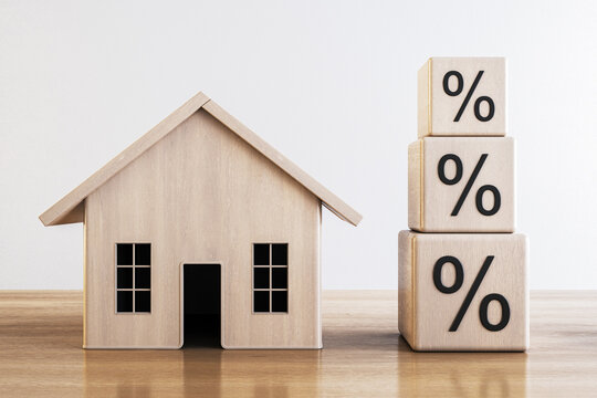Wooden house model with stacked percentage blocks, symbolizing growing mortgage rates. 3D Render