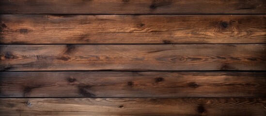 Fototapeta premium A horizontal wooden background with a dark texture provides an empty surface offering ample space for a design or copy space image