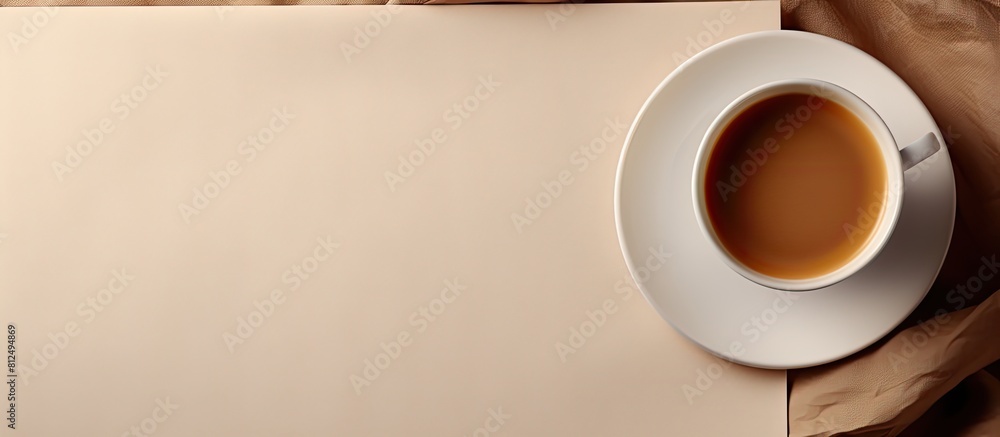 Aufkleber copy space image of a coffee cup on a fabric background with a blank card and tray nearby