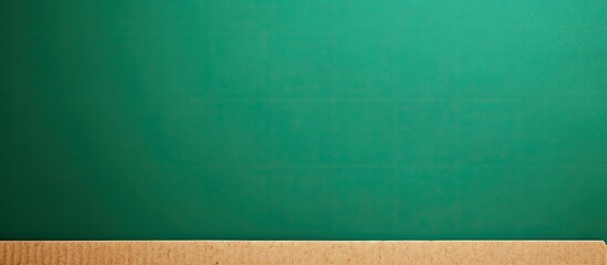 Copy space image of cardboard paper on a green paper background