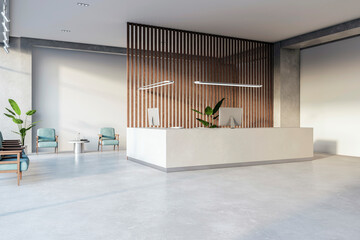 A modern office reception area with a white desk, seating, light fixtures against a wooden slat...
