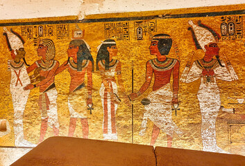 Painted wall relief depicting Tutankhamun and his soul,Ka,embracing Osiris and Goddess Nut inside...