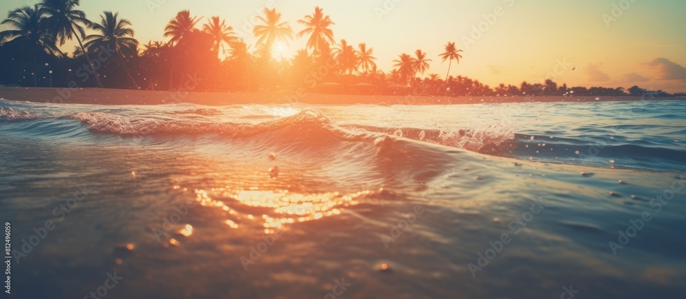 Poster The image features a hazy sunset on a tropical beach with the sunlight creating a bokeh effect on the water It evokes the idea of a summer vacation and travel adventure with a vintage tone filter add