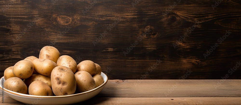 Aufkleber A copy space image featuring a plate of uncooked potatoes is placed on a rustic wooden table