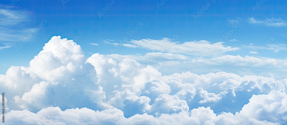 Aufkleber a background image showing a spacious expanse of blue sky and fluffy clouds perfect for adding text 