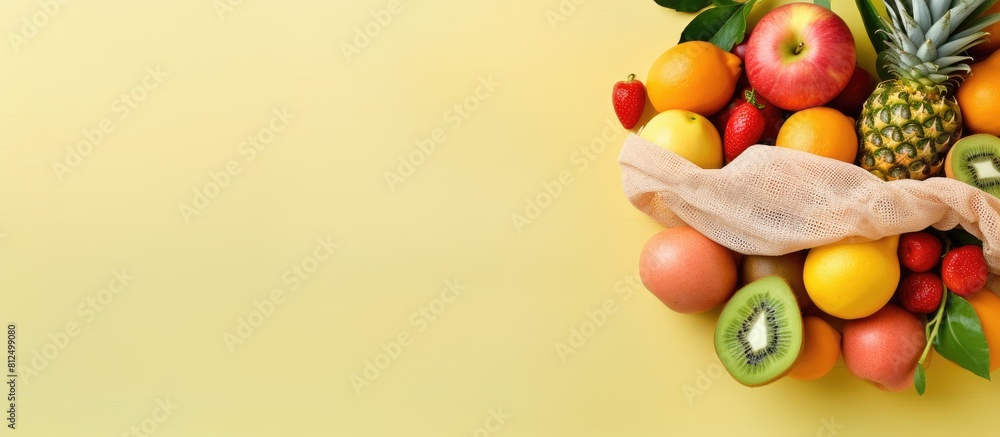 Poster a copy space image of sunlit summer flat lay featuring a variety of fresh fruits arranged in an eco 