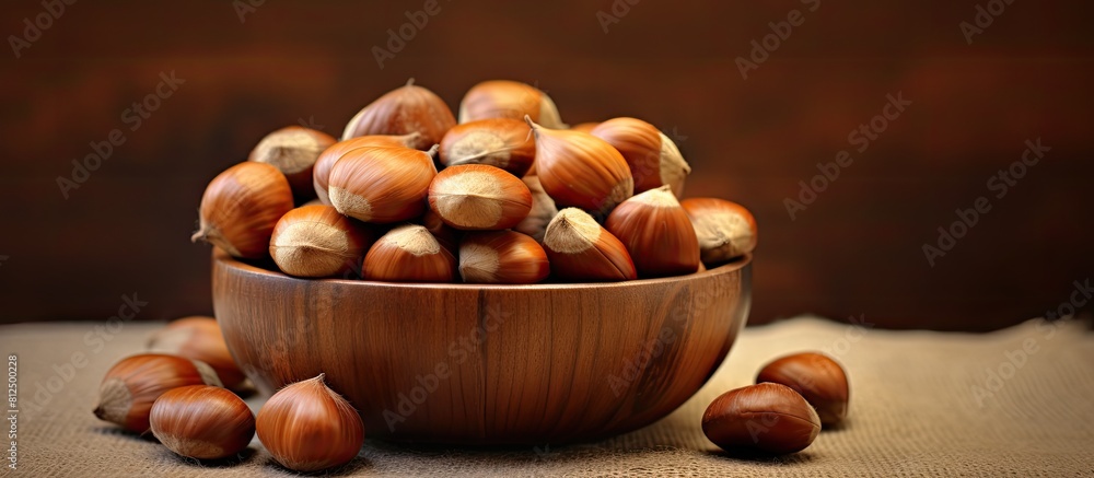 Poster there is a copy space image of chestnuts an edible snack on the table which can be enjoyed as a meal
