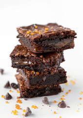 Salted Caramel Brownies on white surface, isolated on white background. 