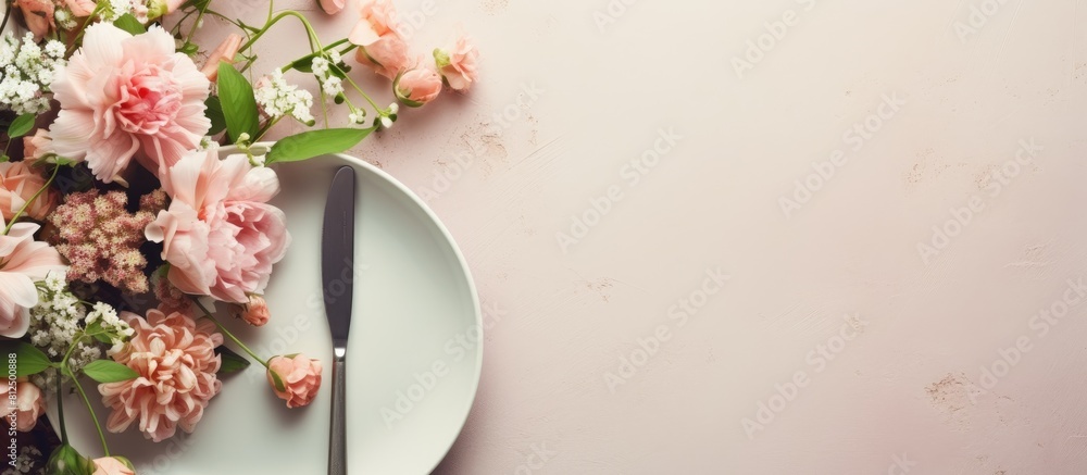Poster a festive table is set with a white plate and cutlery accompanied by a beautiful floral arrangement 