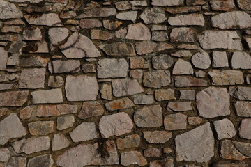 Obraz premium Stone Wall Texture Background, Abstract Architecture of Ancient Stone Structure in Brown and Gray, Rough Surface Pattern