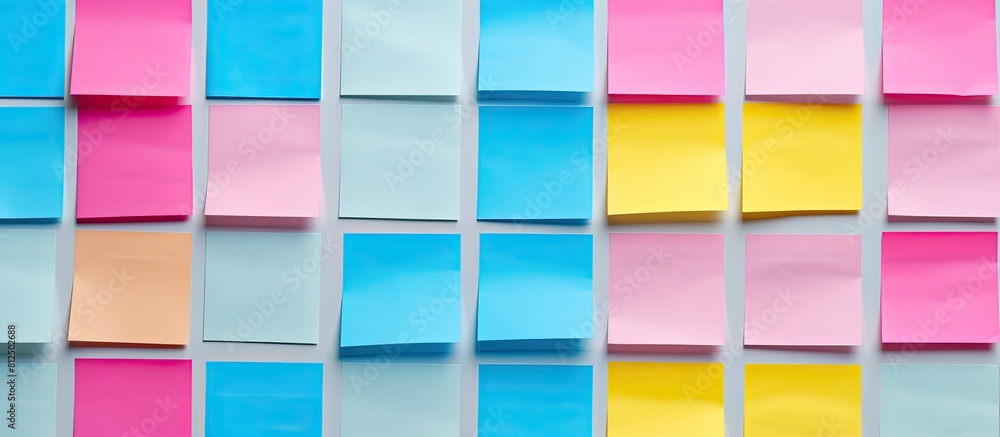 Poster post it notes in the colors of pink blue and yellow are empty and prepared for use as copy space ima