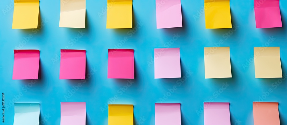 Poster post it notes in the colors of pink blue and yellow are empty and prepared for use as copy space ima