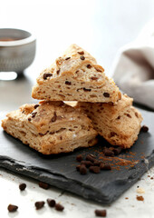 Chai-spiced Scones on slate tile, isolated on white background. Traditional Scones. Dessert.