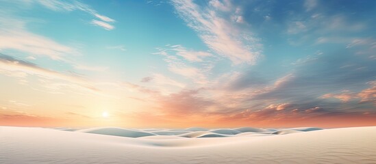 A peaceful and relaxing summer concept of a desert beach at sunset with a white sandy background and ample copy space for your image