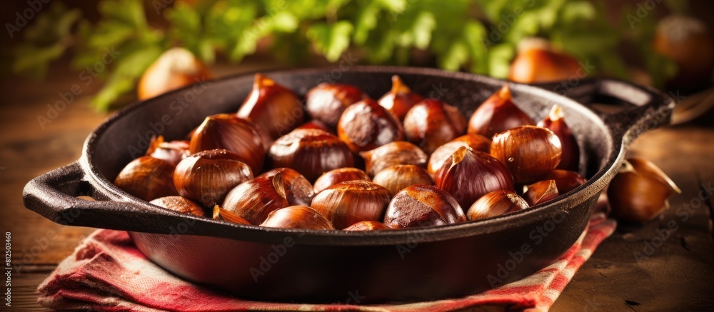 Aufkleber Chestnuts perfectly roasted and served in a rustic chestnut pan rest on a vintage table creating a charming copy space image