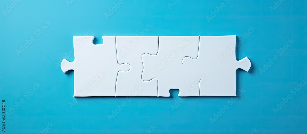 Poster texture photo with copy space image of a folded white jigsaw puzzle on a blue plastic surface