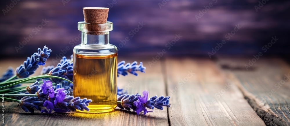 Poster a relaxing lavender essential oil with its soothing aroma captured on a beautiful blue textured wood