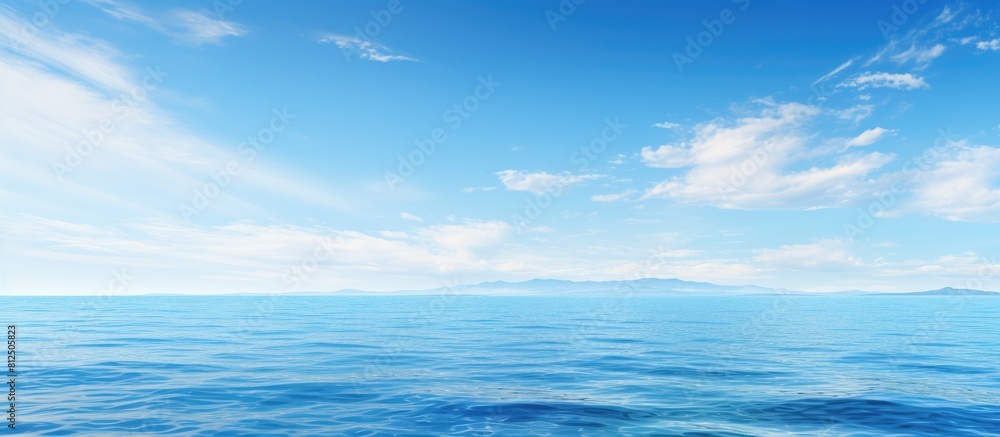 Aufkleber a serene background featuring the expansive sea and a clear blue sky with ample space for adding ima