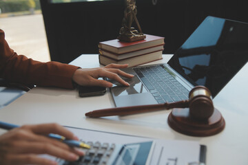 American woman lawyer or businesswoman African working with laptop, searching, analyzing data,...