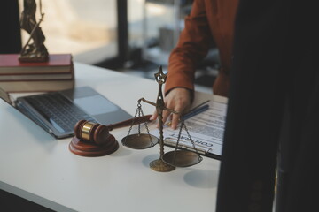 American woman lawyer or businesswoman African working with laptop, searching, analyzing data,...