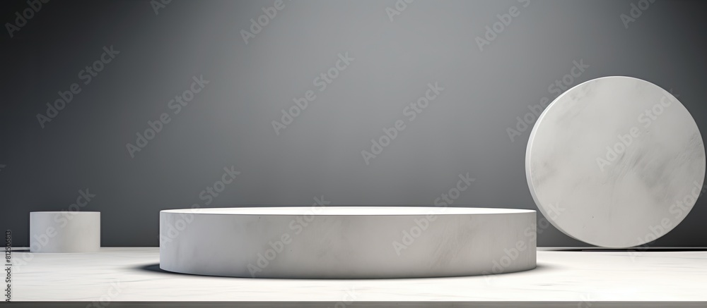 Poster A side view of white table with gray concrete circle shaped pedestals offering copy space for a stunning image It serves as a stone platform and an abstract geometric pedestal with a design perfect f