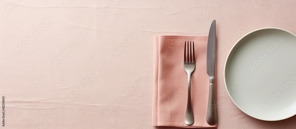Poster A minimal style table setting for Easter spring with fork knife and napkin The background features a close up top down view with ample copy space