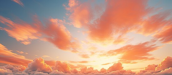 A stunning sky with vibrant colors during sunset or sunrise featuring an orange hue blending with the clouds creating a picturesque background suitable for a copy space image
