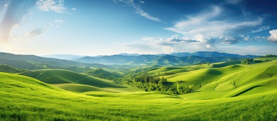 In the summer there is a picturesque landscape of green hills in the upland area creating a serene and captivating copy space image